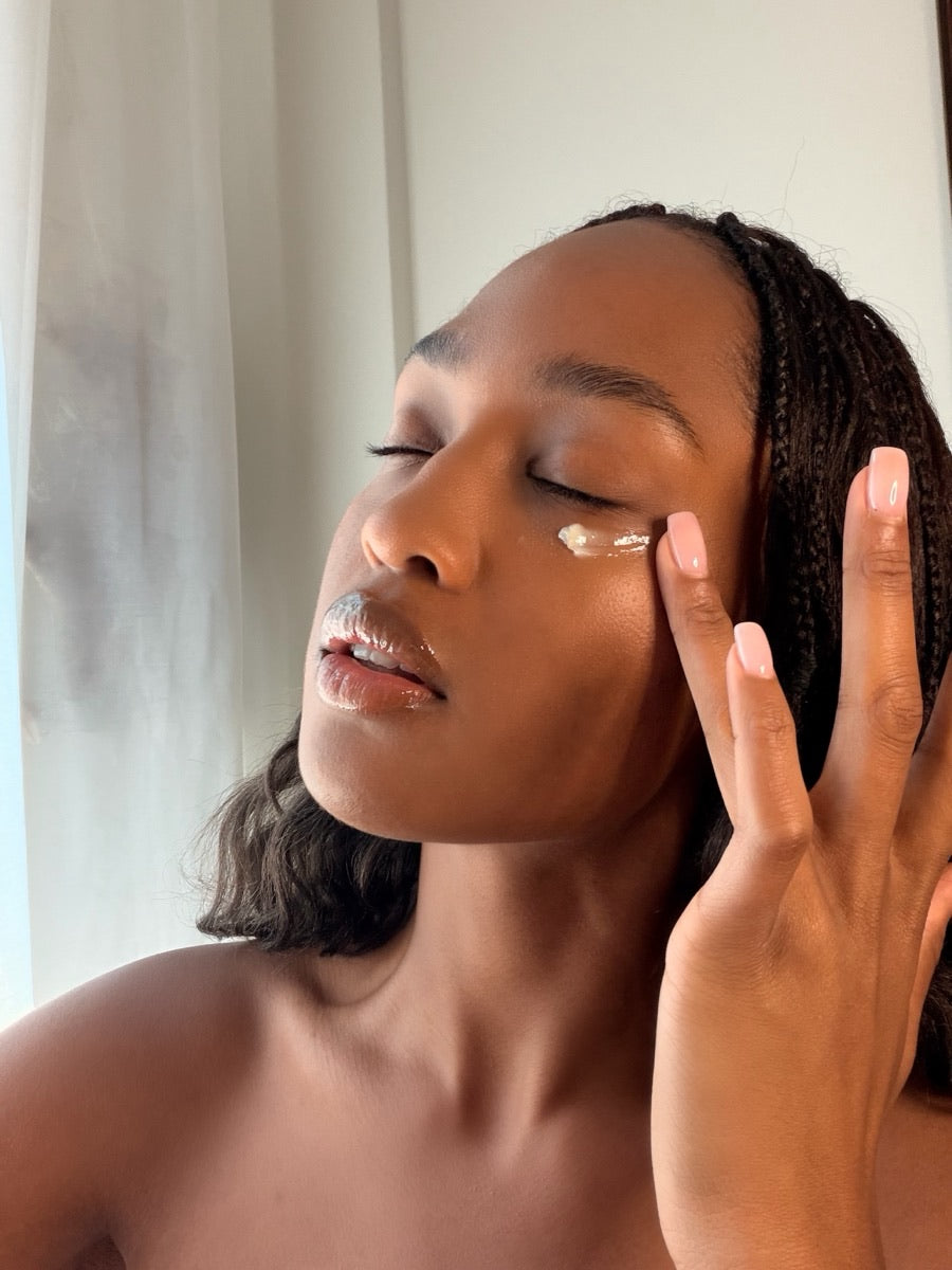Bailey applying the Golden Glow Eye Balm under her eye